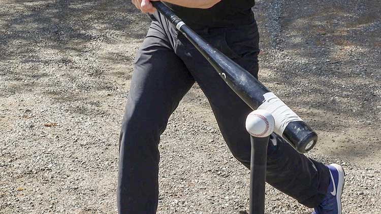 Making contact on sweet spot of a baseball bat
